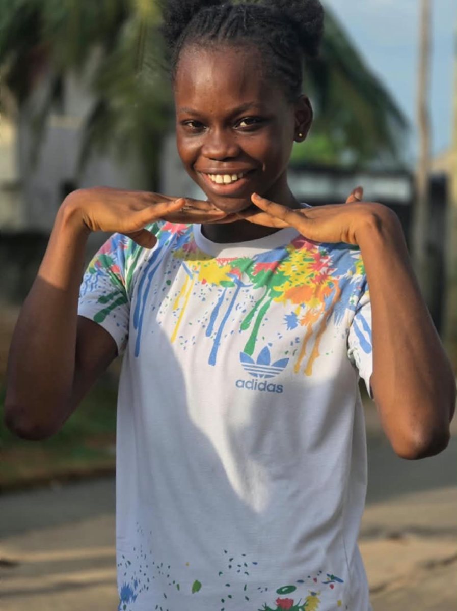 Success Onyinyechi Onu smiling in a colourful t-shirt