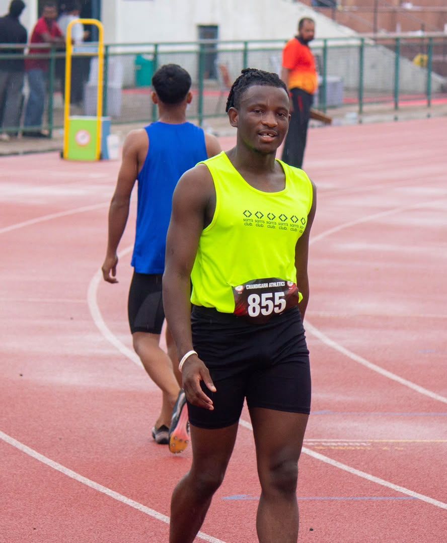 Sprinter wearing race number 855 on the track