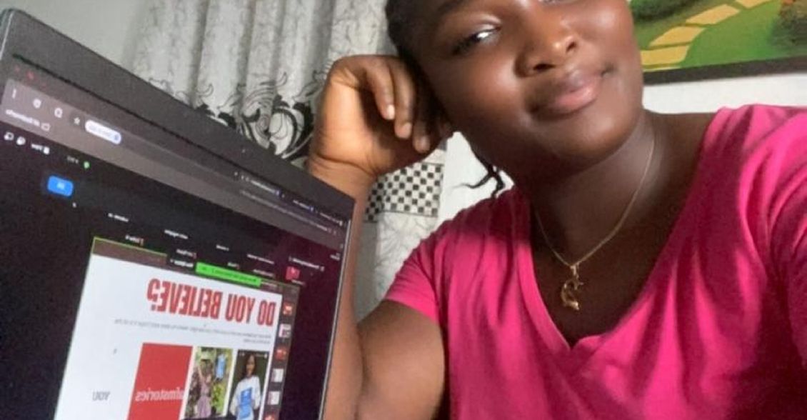 Athlete smiling while attending the masterclass on a laptop